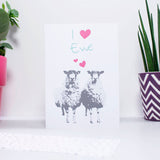 I love you (heart shape) you card zoomed out photograph showing plants on either side, with two sheep below the text and two little love hearts between the two sheep. A great anniversary card for sheep lovers and farmers alike.
