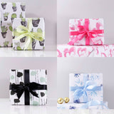 Git wrapping paper options which are all over repeat patters, you can choose from green cactus pink heart green and black dot or blue snowflakes all come with matching colour ribbon 